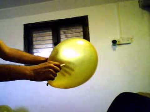 popping balloon with pen