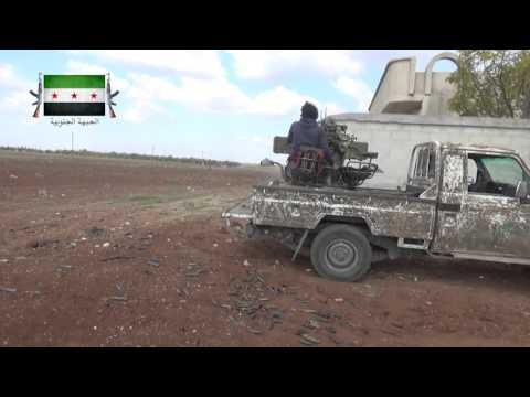 التمهيد الناري للتقدم باتجاه الإسكان العسكري في الشيخ مسكين في ريف درعا بالرشاشات الثقيلة من قبل الجيش الأول