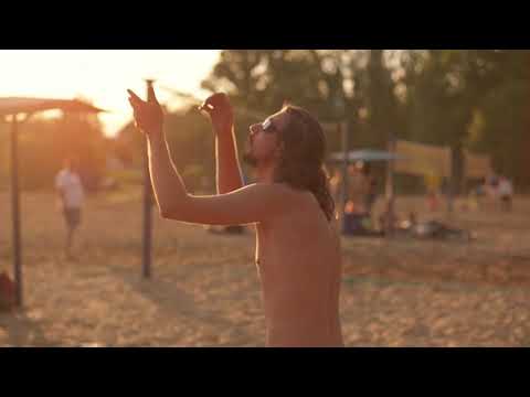 man playing volleyball on the beach
