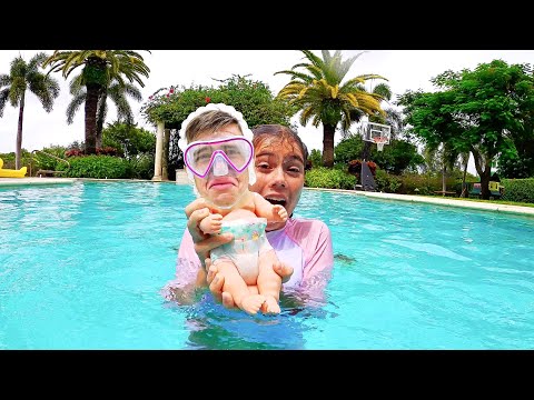 Nastya found a boy doll and pretends to be a parent