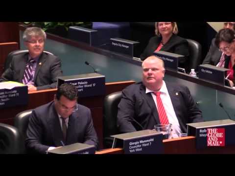 Toronto Mayor Rob Ford pretends to drink and drive at City Council Chambers