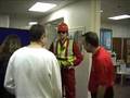 Fall arrest harness being put onto mannequin man by member of the public at a Safety clothing and PPE exhibition by ARCO at family open day at BAE (British Aerospace Engineering) systems in Rochester #7 (flash) Fall arrest harness being put onto mannequin man by member of the public at a Safety clothing and PPE exhibition by ARCO at family open day at BAE (British Aerospace Engineering) systems in Rochester #7 (flash)
