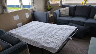 Demonstration of unfolding and folding the sofa bed shipped in many UK Caravans like ABI Adelaide.