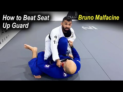 How To Beat The Jiu Jitsu Seat Up Guard by Bruno Malfacine
