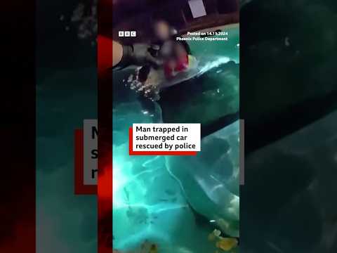 Video | US man rescued from car submerged in pool. #US #Police #BBCNews