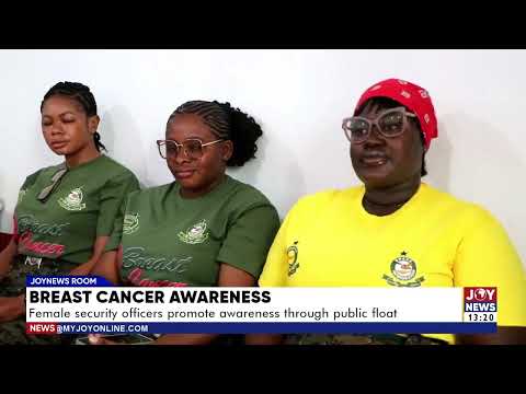Breast cancer awareness: Female security officers promote awareness through public float.
