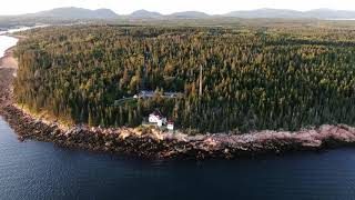 Aerial drone footage of a sunset over lighthouse in Acadia, Maine 4k