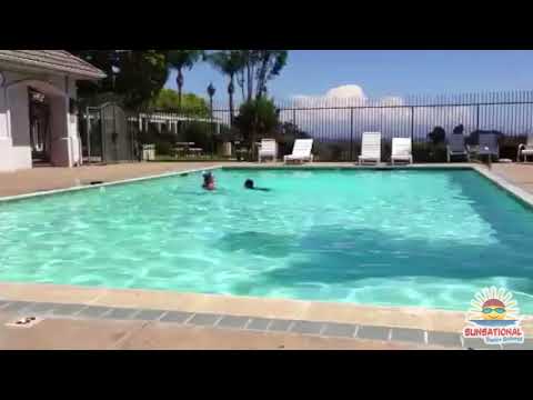 Little student swim across the pool