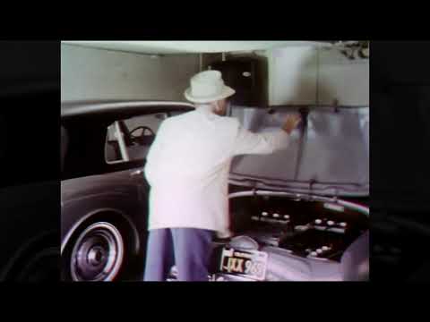 Jascha Heifetz driving his electric car and playing ping pong