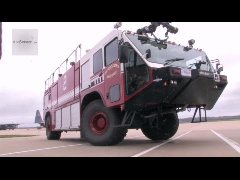 U.S. Air Force Airmen Operate Fire Truck In Gas Masks