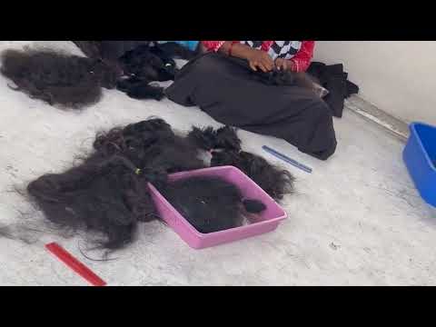 Raw Indian temple hair cleaned by hand at the facility