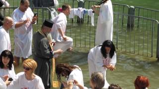 preview picture of video 'Yardenit 'baptism site, the Jordan River,  Israel - Russian Orthodox Christian believers'