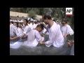 Mass baptism of 1,000 Brazilian pilgrims in River ...