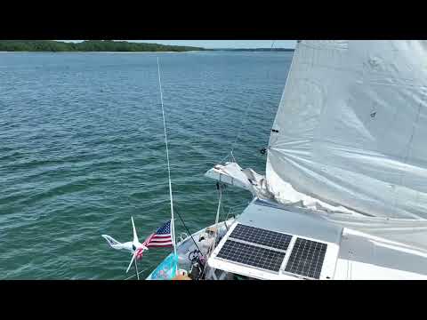 Bachelorette party swimming off catamaran yacht  in Sag Harbor, The Hamptons NY
