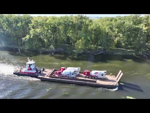 Croell Inc. barging mixers on Mississippi River