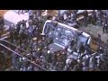 Ferguson protesters flip police car outside city.
