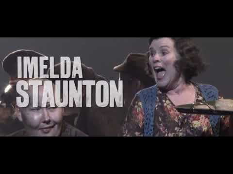 Sweeney Todd stage musical trailer still — blood-red title over stark staging