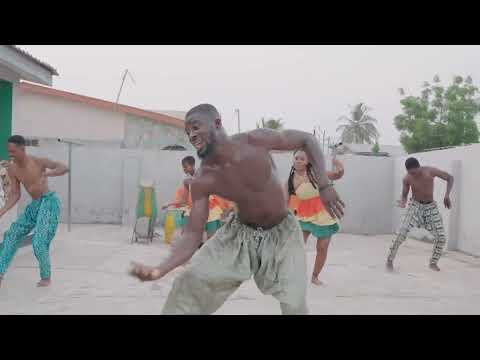 PERFORMING THE "KPANLOGO" DANCE