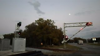 preview picture of video 'CSX Train Cruises Through Crossing And Signal'