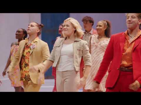 Trailer still showing Donna and the Dynamos performing Super Trouper in glittery costumes