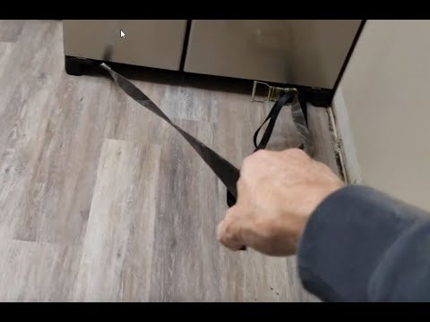 Part of a video titled How to Remove Refrigerator When its Stuck / Wedged ... - YouTube