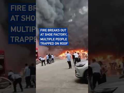 Fire breaks out at shoe factory, multiple people trapped on roof