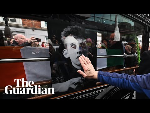 Mourners sing at Shane MacGowan's funeral procession
