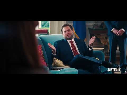 Trailer montage: cable-news desk, tech keynote, and rooftop crowd—mapping big-band bravado to satire, synths to tech hype, and strings to intimacy