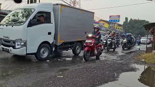 Vehicle traffic on the intersection after rain