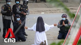 Myanmar nun kneels before junta forces to plead for protesters' lives