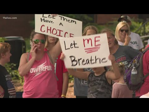 Parents protest school mask mandates as highly contagious COVID Delta variant worms its way deeper i