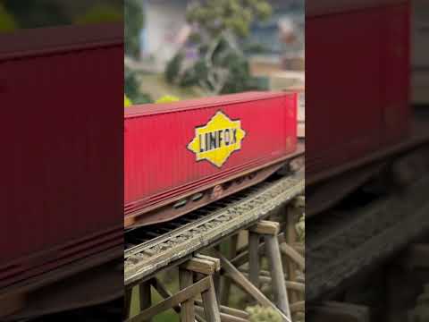 QR National 42103 across a trestle bridge at AMRA open day 2023
