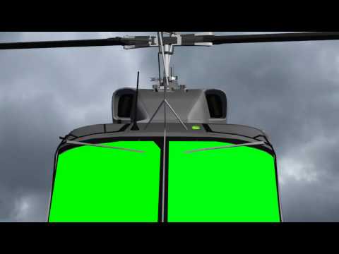 flying helicopter with green screen cockbit