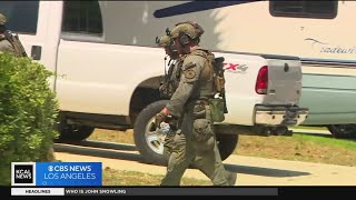 Deputies search the home of Cook's Corner shooter
