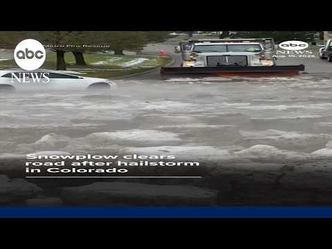 Snowplow clears road after hailstorm in Colorado