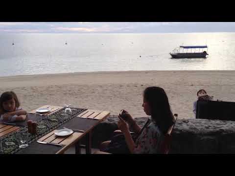 Kids talking at beach restaurant on Qalito Island