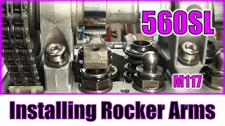 560SL - Montaż dźwigienek zaworowych (rocker arms) i podkładek oporowych M117