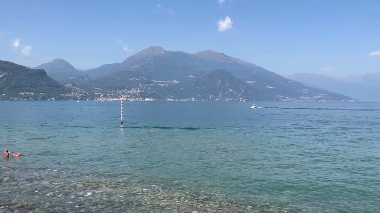 Capture beautiful panoramic views of mountains and lake from Punta Spartivento viewpoint.