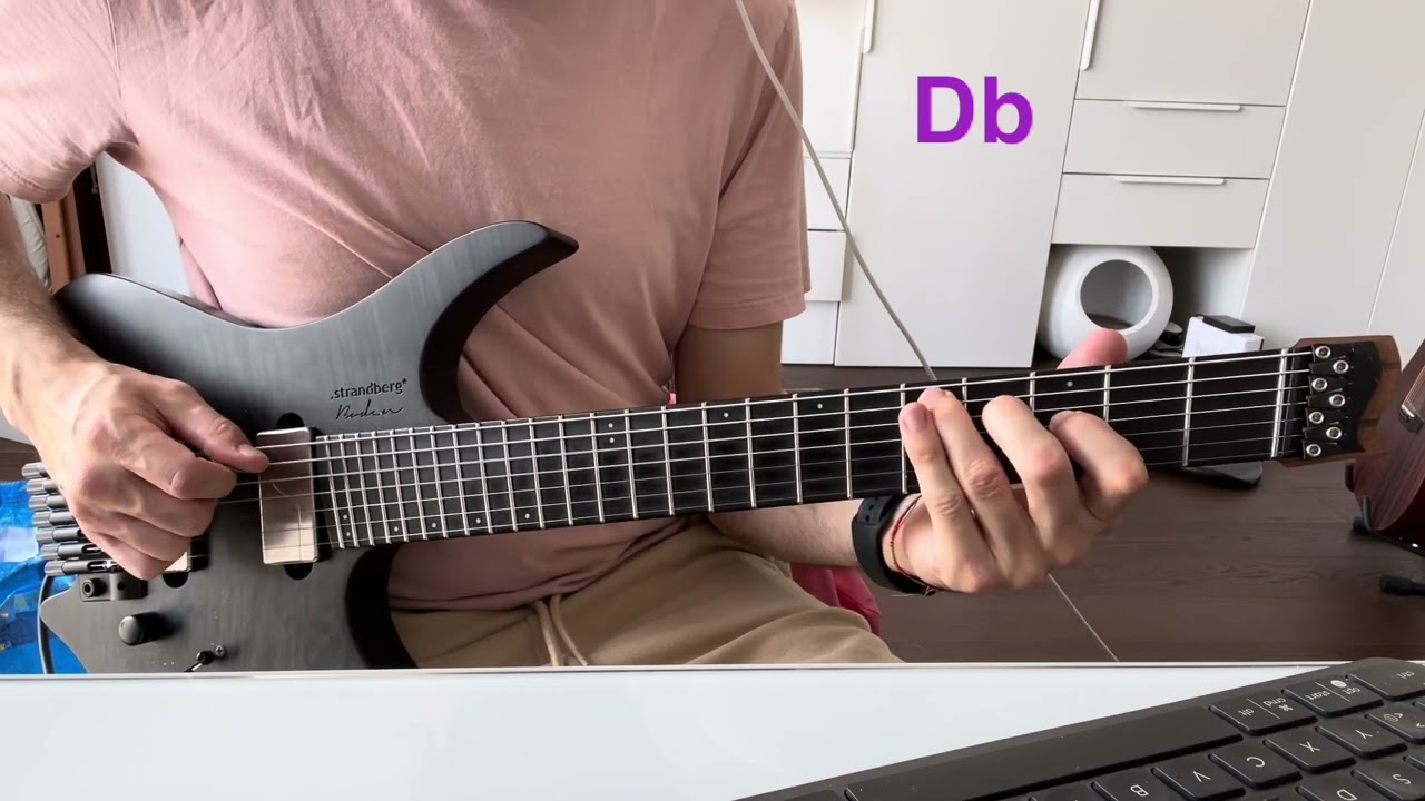 Roberto Barlocci playing augmented triad shapes on the lower strings of an electric guitar