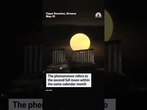 Rare ‘blue’ moon rises over the Poseidon temple in Greece