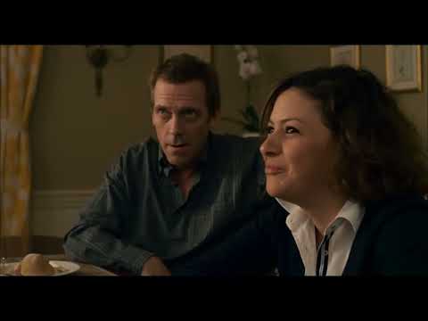 Trailer frame: drive-by of tidy houses as a jangly cue bridges to the next scene