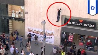 Levitating man: Amazing floating street magician Hezi Dean shocks Israeli crowd