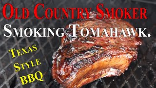 Smoking a Tomahawk on the old country smoker