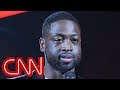 NBA star Dwyane Wade stands with massacre victims