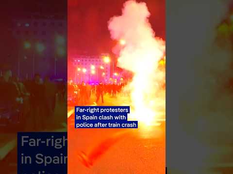 Far-right protesters in Spain clash with police after train crash | DW News