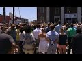 Crowd sings hymns at Charleston shooting vigil.