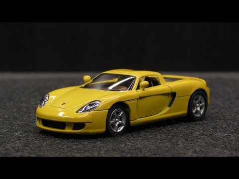 Металлическая машинка Kinsmart 1:36 «Porsche Carrera GT» KT5081W, инерционная в коробке / Микс