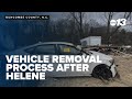 Removing vehicles after Helene in Buncombe County, N.C.