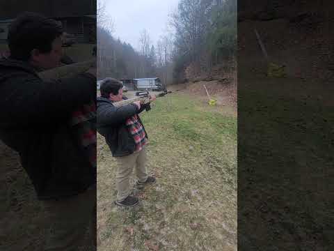 My 13 yr old son with his Iver johnson 12 ga shotgun.