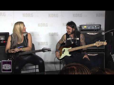 Chuck Garric and Nita Strauss at the Korg Booth at the 2015 NAMM expo.